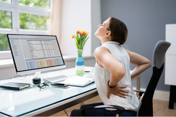 Woman in pain at desk